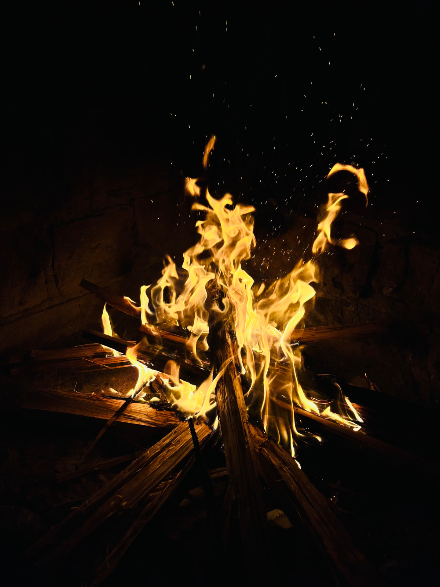 Open wood fire used for charcoal grilling